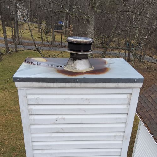 Chimney with Damage to the Cap | Black Goose Chimney Service